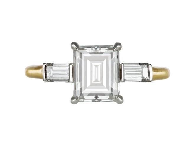Diamond flanked solitaire, circa 1940. 