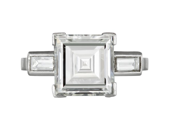 Diamond flanked solitaire, circa 1920. 