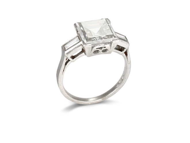 Diamond flanked solitaire, circa 1920. 