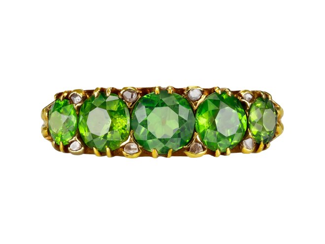 Demantoid Garnet five stone ring, circa 1900. 