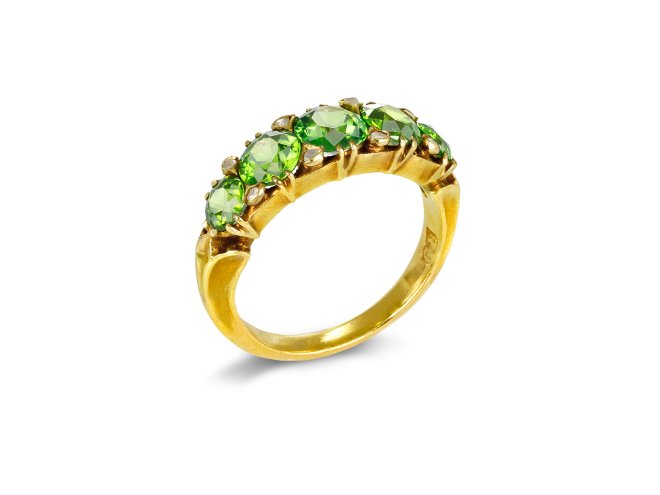 Demantoid Garnet five stone ring, circa 1900. 