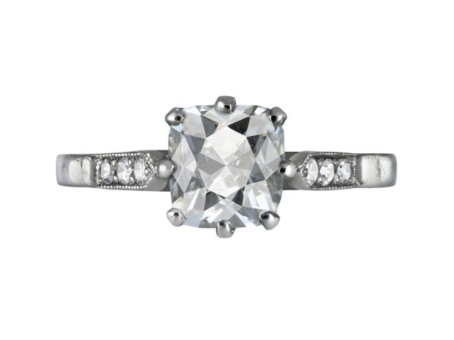 Peruzzi cut diamond flanked solitaire, early 20th Century.