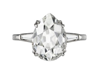 Chaumet 5.00 carat drop shape diamond flanked solitaire, French, early 20th Century.