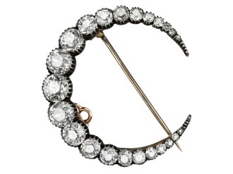 Victorian diamond crescent moon brooch, circa 1890.