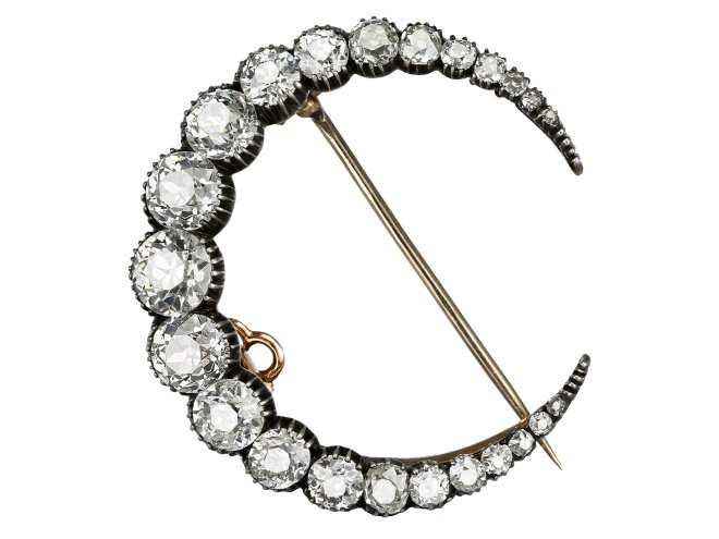 Victorian diamond crescent moon brooch, circa 1890.