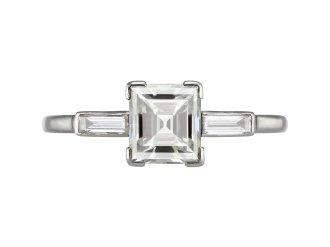 Diamond flanked solitaire, early 20th Century.