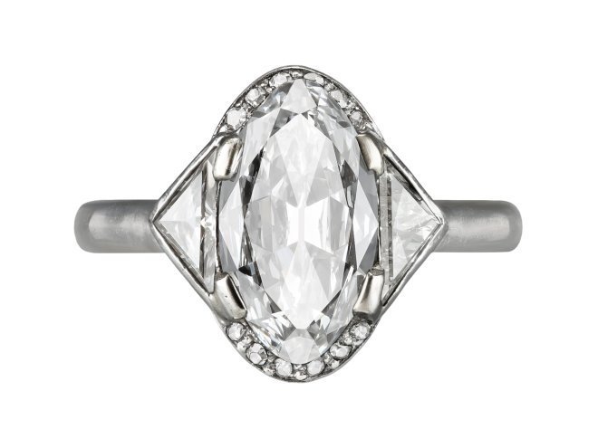 Diamond flanked solitaire, French, circa 1930.