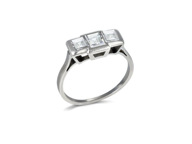 Step cut diamond three stone ring, French, early 20th Century. 