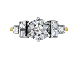 Diamond flanked solitaire ring, circa 1940.