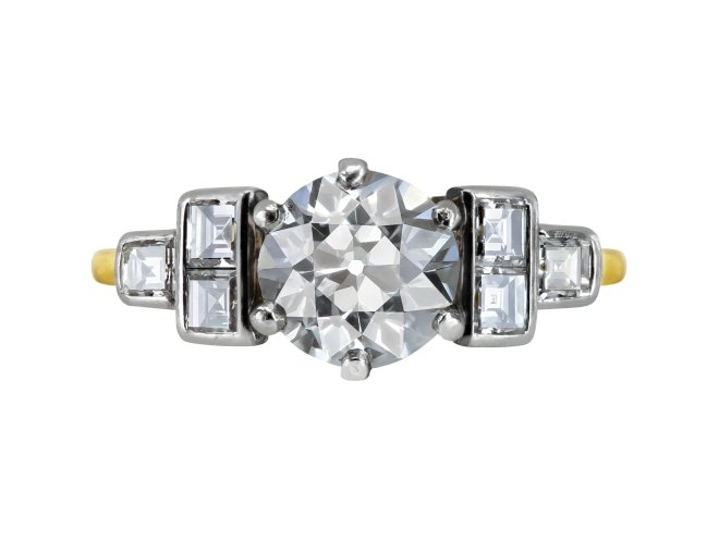 Diamond flanked solitaire ring, circa 1940.