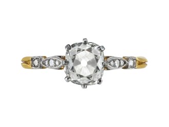 Old mine diamond flanked solitaire ring, early 20th Century.