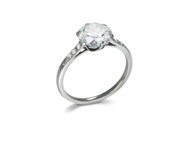 Old cut diamond flanked solitaire ring, circa 1920. 