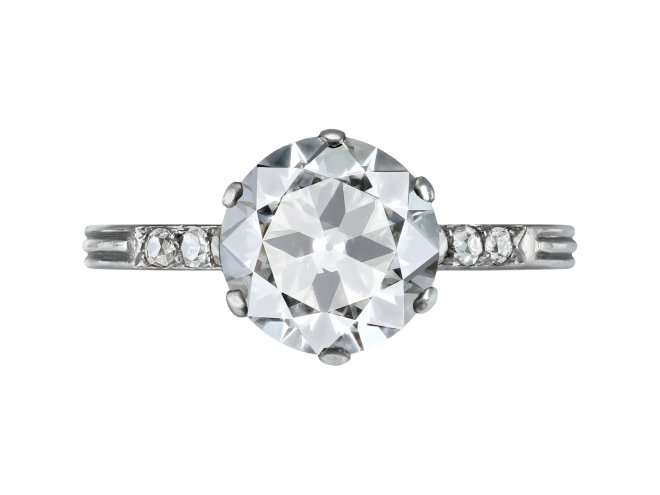Old cut diamond flanked solitaire ring, circa 1920. 