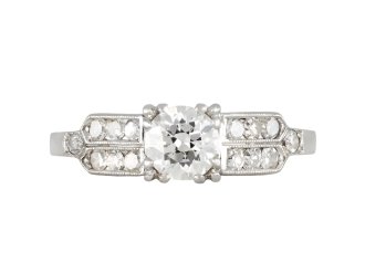 Diamond flanked solitaire ring, American, circa 1940.