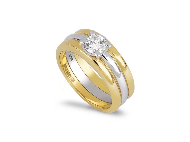 Contemporary solitaire diamond ring in 18ct yellow gold.