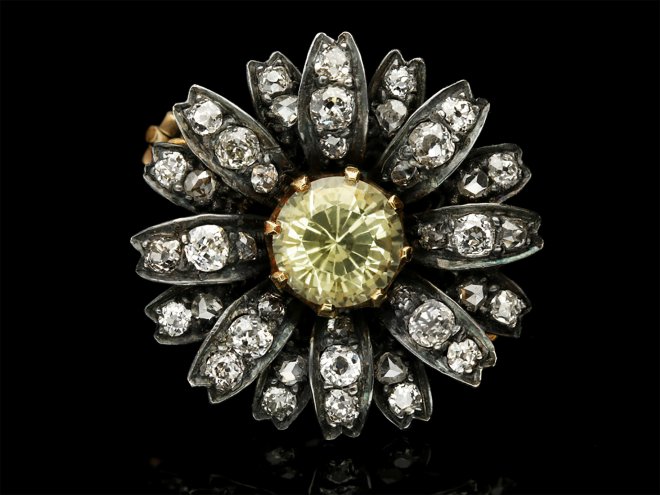 Victorian yellow sapphire and diamond flower brooch, circa 1880.