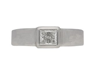  A diamond solitaire ring mounted in platinum.