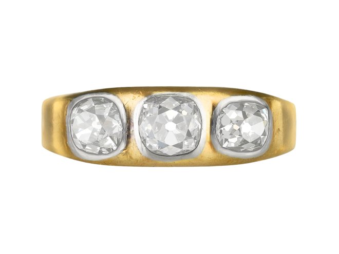Three stone diamond gypsy ring, circa 1900.