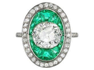 Old mine diamond and emerald cluster ring, circa 1920.