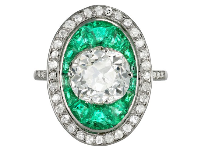 Old mine diamond and emerald cluster ring, circa 1920.