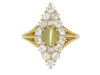 Antique 'cat's-eye' chrysoberyl and diamond marquise cluster ring, circa 1900.