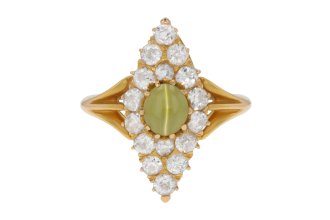 Antique 'cat's-eye' chrysoberyl and diamond marquise cluster ring, circa 1900.