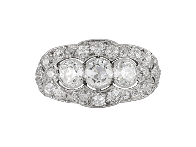 Three stone diamond cluster ring, circa 1920. 