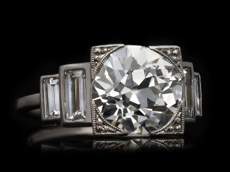 Art Deco diamond flanked solitaire ring, English, circa 1930. Hatton Garden