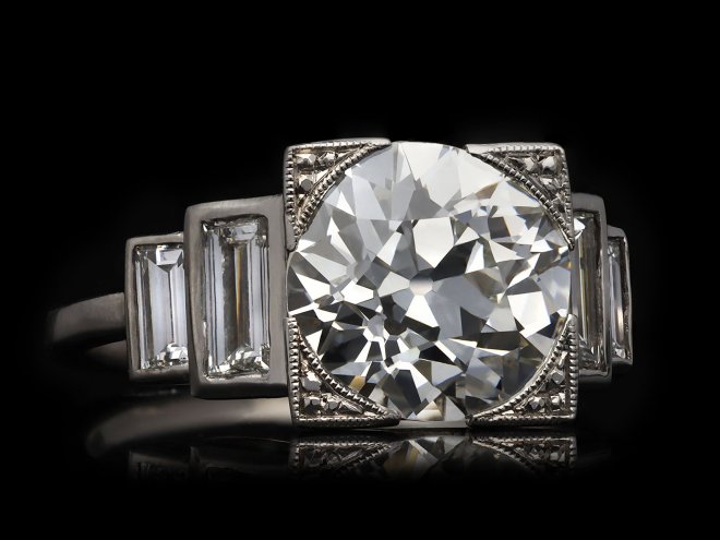 Art Deco diamond flanked solitaire ring, English, circa 1930. Hatton Garden