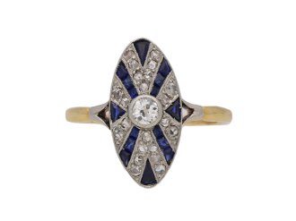 Diamond and calibré cut synthetic sapphire ring, circa 1920.